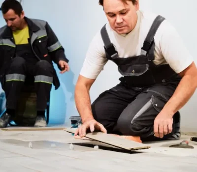 installing-ceramic-floor-tiles-construction-site-construction-workers-workers-laying-tiles-floor-with-cement-adhesive-renovating-floor_166373-2132